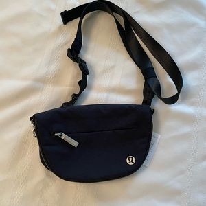Black Lululemon all-night micro festival bag, zip top. NWT
